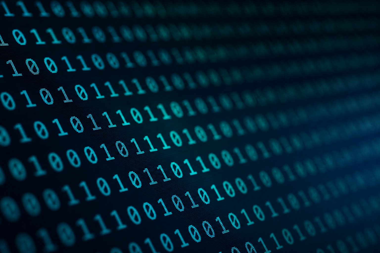 Rows of binary digits on a dark computer display